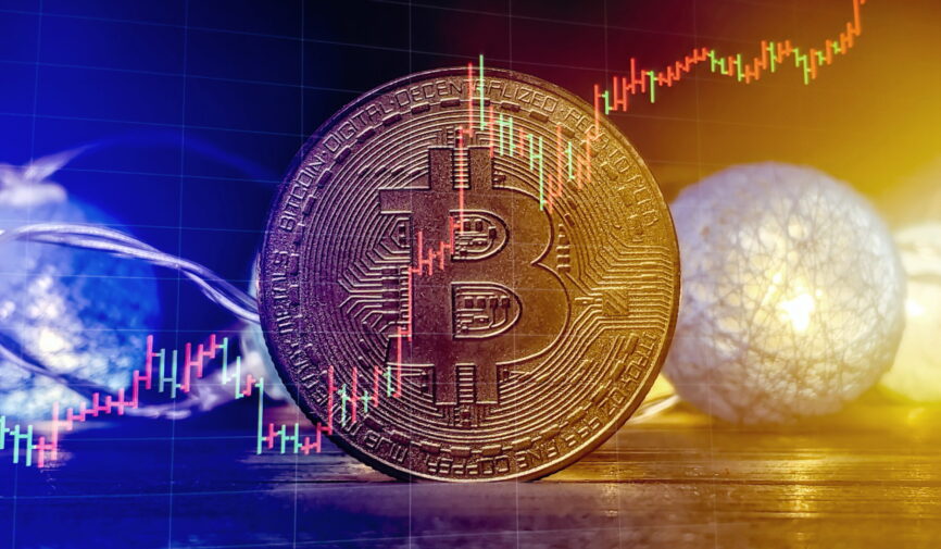 Bitcoin Stock Growth. Chart shows a strong increase in the price of bitcoin. Bitcoin gold coin and defocused chart background. Virtual cryptocurrency concept.